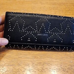 Jimmy Choo black leather long wallet adorned with silver studs and a star motif